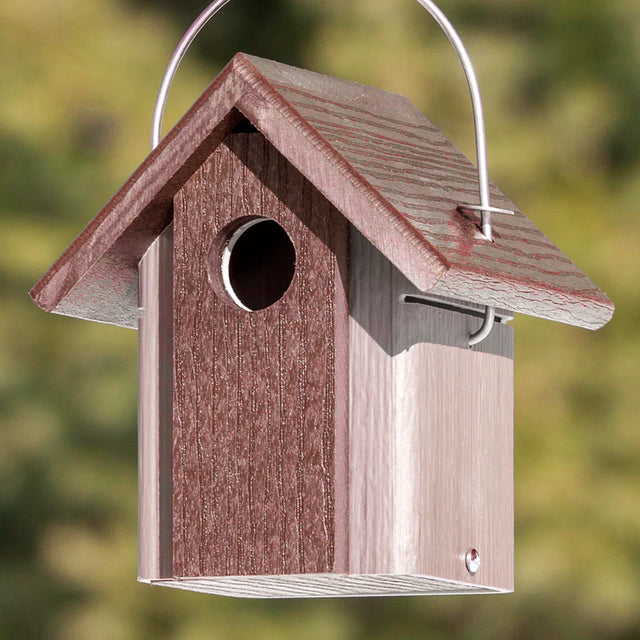 Hanging Chickadee Bird House with wire hanger, overhanging roof, and 1-1/4 inch entry hole; features built-in ventilation, drainage, and squirrel lock for predator protection.