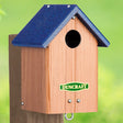 Duncraft Bluebird Post-Tree Mount House with blue roof, slotted ventilation, and 1-1/2 inch entry hole, made from durable recycled plastic.