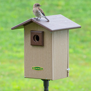 Duncraft Bird-Safe® Premium Observation Bluebird House & Pole features a bird perched on the birdhouse, highlighting its protective and observational design.