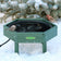 Duncraft Hexagon Heated Ground Birdbath in use, attracting birds in snowy winter conditions. Made of durable green recycled plastic with a black heated dish.