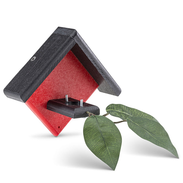 Duncraft Little Red Hummingbird House with two metal posts and a leaf-adorned landing branch, designed for secure nest placement under eaves.