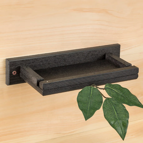 Barn Swallow & Phoebe Nesting Shelf, a black recycled plastic platform with a green leaf, designed for safe and durable bird nesting. Includes mounting hardware.