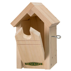 Duncraft Common Bird Pine Nesting House with a triangular roof, recessed entry hole, and front panel for easy cleaning. Features built-in ventilation and overhanging roof.