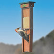 Pileated Woodpecker Suet Shield Wrap Feeder with stainless steel mesh and tail prop, holding two suet cakes, preventing squirrel damage and suet gorging.