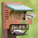 Duncraft Woodpecker Delight Bird Feeder with peanuts and suet cage. Tufted titmouse on peanut tray; woodpecker feeds from suet cage below.