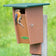 Duncraft Slot Bluebird Trail House with eastern bluebird perched at the slotted entrance, designed to deter larger birds and protect nestlings.