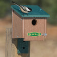 Duncraft Chickadee Roosting House with Swivel Mounting Bracket, featuring a bird perched on the house, ideal for small birds to stay warm.