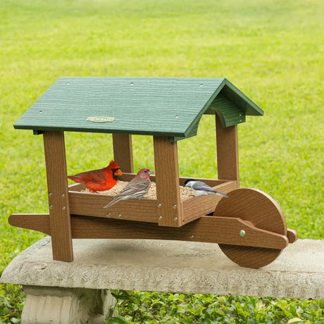 Duncraft Covered Garden Cart Platform Feeder on stone bench with three songbirds eating seed; features green roof, durable build, and rust-free drainage design.