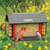 Red Barn Cardinal Feeder with seed center and suet sides, featuring a Northern Cardinal, chickadee, and wren, designed for year-round bird attraction.