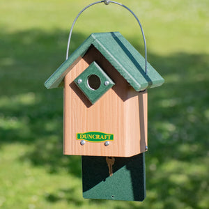 Duncraft Hide-A-Key Bird House with a green entry hole, wire hanger, and secret key compartment at the bottom for secure key storage.