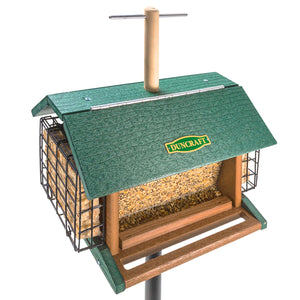 Duncraft Morning Song Post Hopper & Pole features a wooden bird feeder with a green roof, two seed trays, suet cakes, and a lookout perch for bird viewing.