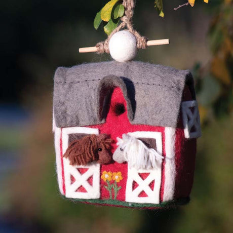 Woolie Country Stable Bird House featuring a barn design with two horses, handmade with water-resistant wool, jute cord, and bamboo perch, perfect for small birds.