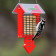 Duncraft Red Arrow Tail Prop Suet Feeder with a woodpecker feeding on suet inside a red metal wire-mesh cage.