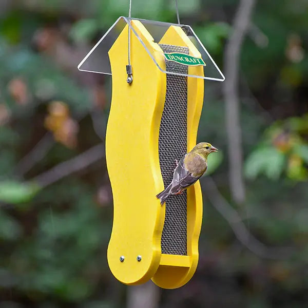 Duncraft Fancy Finch Nyjer® Wave Feeder with wavy mesh design, features a small songbird feeding, showcasing dual-side feeding capability and a protective clearview roof.