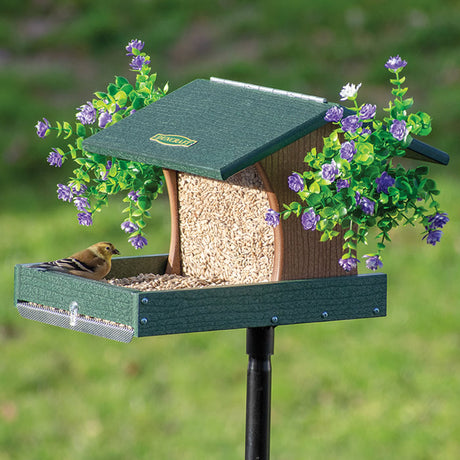 Duncraft Back to the Woods Cardinal Landing Tray with Pole featuring a bird in the feeder with extended tray and overhanging roof for weather protection.