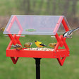 Duncraft Double Diamond Post Platform Feeder with multiple birds feeding, featuring a diamond design and a clearview roof for weather protection.