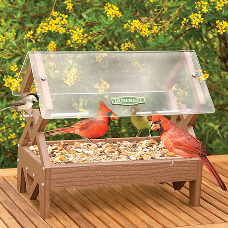 Duncraft Double Diamond Platform Feeder with birds feeding, featuring a clearview roof and multiple entry points. Durable, easy to clean, and holds 2 lbs. of seed.