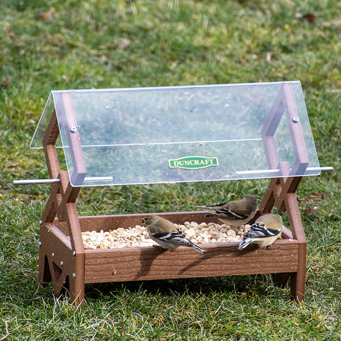 Duncraft Double Diamond Platform Feeder with birds feeding, featuring a sturdy design, large clearview roof, and easy-clean seed tray.