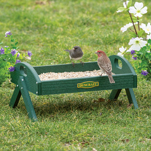 Duncraft EZ Move Ground Platform Feeder: Birds perched on a durable green, metal mesh tray feeder with four legs, designed for easy viewing and drainage.