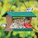 Duncraft Grandview Hopper Feeder with green roof, filled with seeds, features Northern Cardinal and tufted titmice feeding, showcasing its large capacity and bird-friendly design.