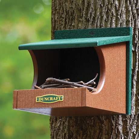 Duncraft Eco-Strong Robin Nesting Shelf, mounted on a tree, featuring an open nesting area ideal for robins and other birds.