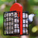 Duncraft Double Suet Feeder with red support panel, features a white-breasted nuthatch feeding on suet. Dual-sided for easy bird access and durable construction.