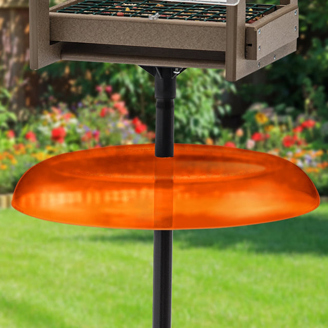 Duncraft Pole Baffle, Orange - Made in the USA, shown mounted on a pole, designed to prevent squirrels from accessing bird feeders or houses.