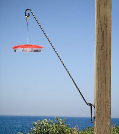 Five Position Wall Bracket with bird feeder, mounted on a metal pole. The bracket features a 180-degree swinging arm for easy filling and repositioning.