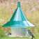 Arundale Emerald Sky Cafe bird feeder with chickadee and downy woodpecker feeding, showcasing green plastic design, large seed tray, and anti-squirrel baffle.