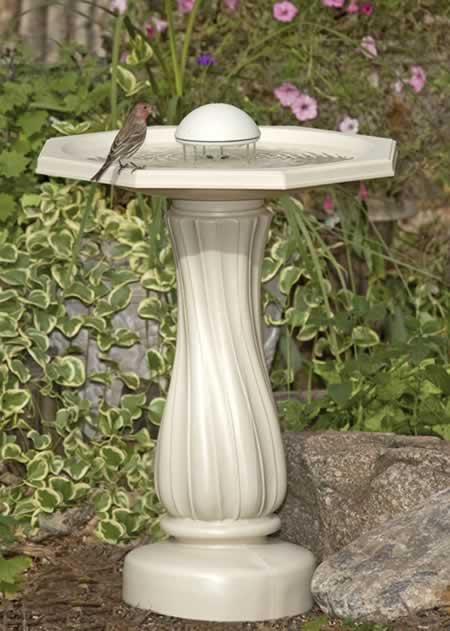 Water Rippling Birdbath with a bird on the white pedestal, featuring a 20-inch basin and Water Wiggler to attract birds and prevent mosquitoes.