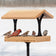 Platform Feeder with a wooden roof, housing five songbirds, features a sturdy cedar structure and open design, ideal for various bird foods.