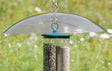 20 Clear Squirrel Baffle, featuring a hanging design, protects bird feeders from squirrels with a wide, tilting baffle filled with seeds.