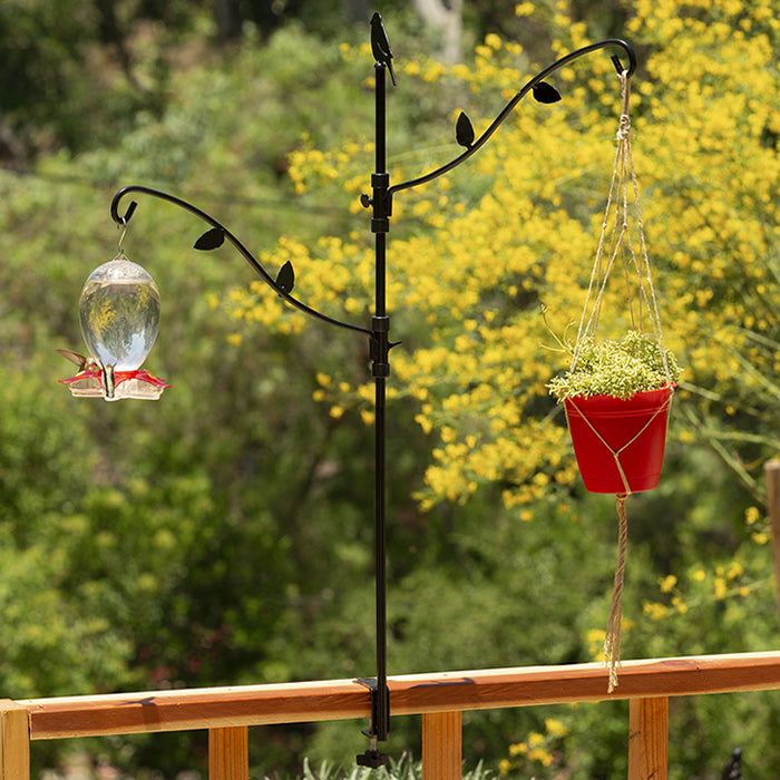 34 Deck Kit with Adjustable Branches featuring two plant hangers, a decorative bird, and metal leaves, attached to a deck railing.