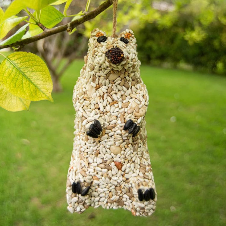 Snow Bear Wild Bird Seed Feeder: Squirrel-shaped bird feeder made of sunflower hearts, featuring seed paws, berry eyes, and a jute hanger for easy display.