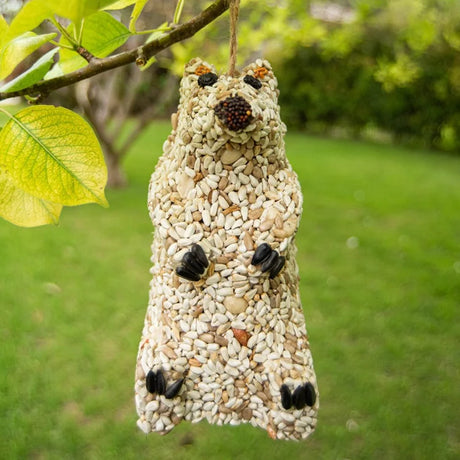 Snow Bear Wild Bird Seed Feeder: Squirrel-shaped bird feeder made of sunflower hearts, featuring seed paws, berry eyes, and a jute hanger for easy display.
