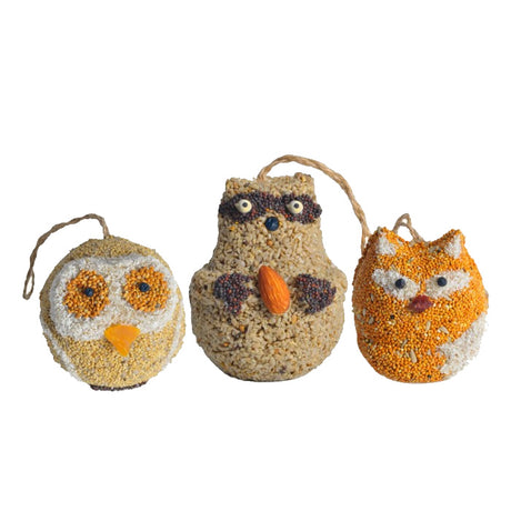 Woodland Friends, Set of 3: Edible bird seed balls shaped like owls, foxes, and raccoons. Features sunflower hearts, millet, corn grits, and berries.