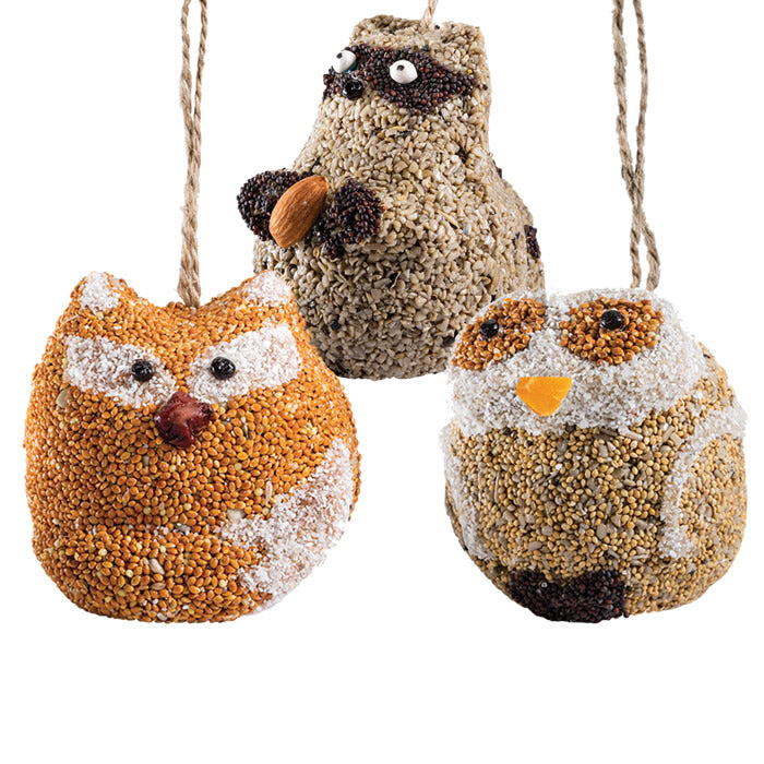 Woodland Friends, Set of 3: Handmade bird seed ornaments shaped like an owl, fox, and raccoon, featuring natural ingredients and a jute hanger for easy setup.