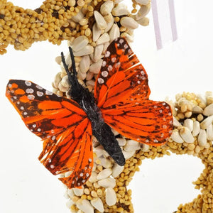 Gingerbread Men, Set of 3 (Copy): Bird-feed wreath with butterfly decoration, crafted from bird seed on grapevine, adorned with dried floral and ribbon for outdoor bird attraction.