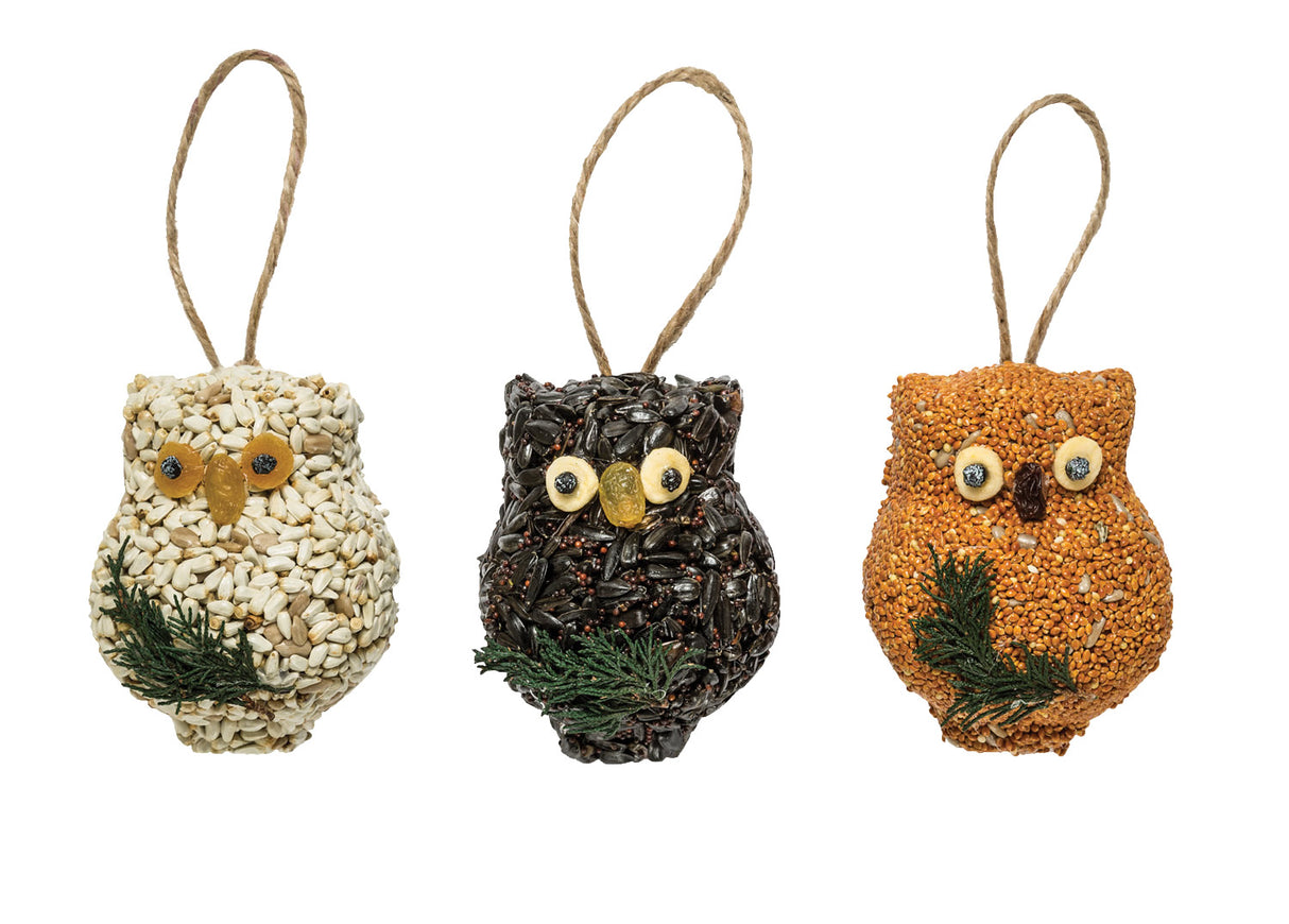 Ollie the Owl, Set of 3: Trio of owl-shaped bird seed treats, featuring millet, sunflower seeds, raisins, and berries, each with a jute hanger for easy tree branch hanging.