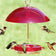 Hummerfest Feeder & Weather Guard with hummingbirds feeding, featuring red umbrella-style cover, brass hook, six ports, and clear basin, set against a green backdrop.