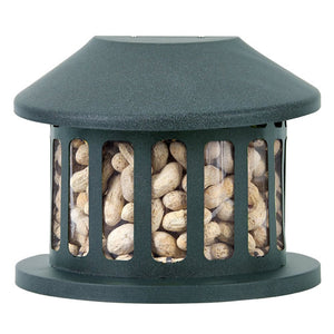 Squirrel Diner bird feeder filled with peanuts, featuring a natural slate green finish, chew-proof rust-resistant steel, and an overhanging roof for weather protection.