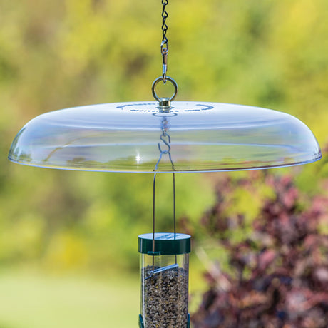 Duncraft Tilt-Top Squirrel Baffle hanging from a chain, designed to tilt and slide squirrels off, shown close-up with visible metal fittings.