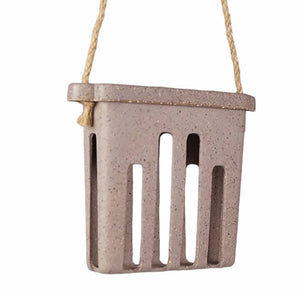 Nut Husks Suet Cake Feeder, a basket with holes, made from recycled agricultural waste. Ideal for attracting birds, holds one suet or seed cake, includes twine hanger.