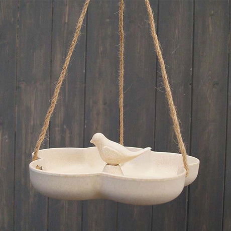 Natural Hanging Bird Bath: A bamboo bird feeder and bath, showcasing a bird perched on it, highlighting its eco-friendly, dual-purpose design, suitable for outdoor use.