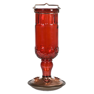 Red Antique Bottle Feeder with a vintage red glass container and brushed copper metal base, designed for hummingbirds with 24 oz. capacity and four feeding ports.