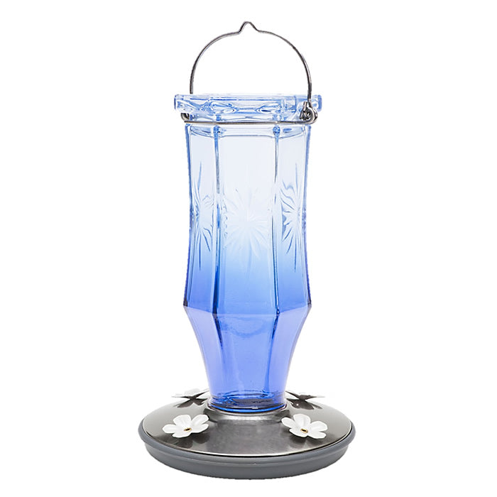 Vintage Sapphire Starburst Hummingbird Feeder with blue glass reservoir, embossed starburst design, and white flower-shaped feeding ports. 16 oz. capacity with 4 feeding ports.