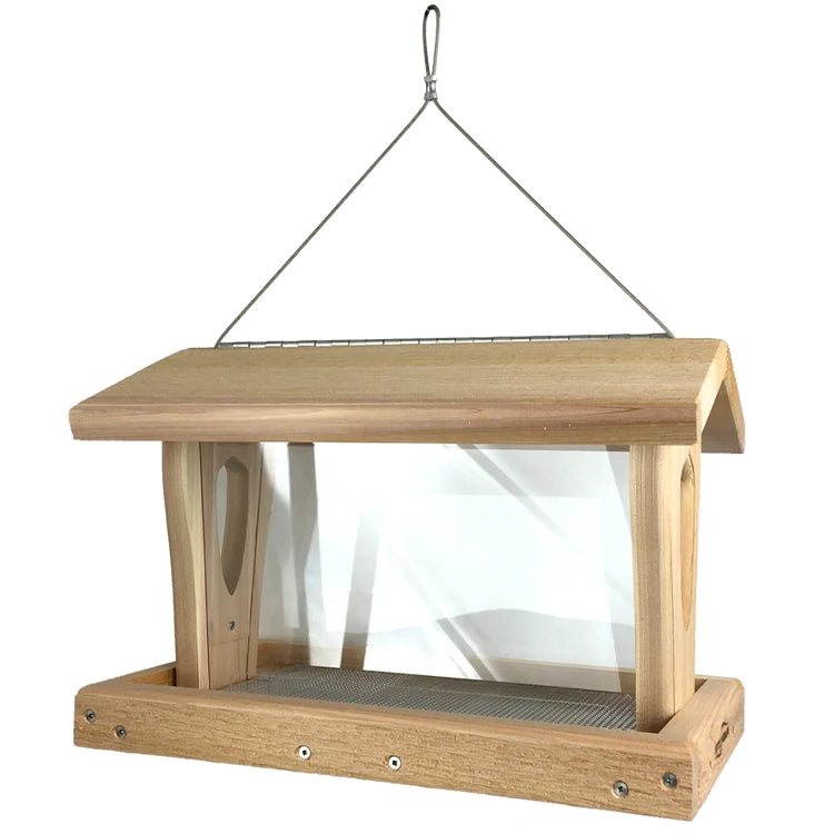 Side profile of cedar bird feeder with transparent seed reservoir and wide feeding tray.