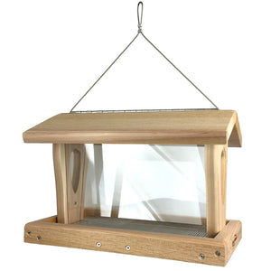 Side profile of cedar bird feeder with transparent seed reservoir and wide feeding tray.