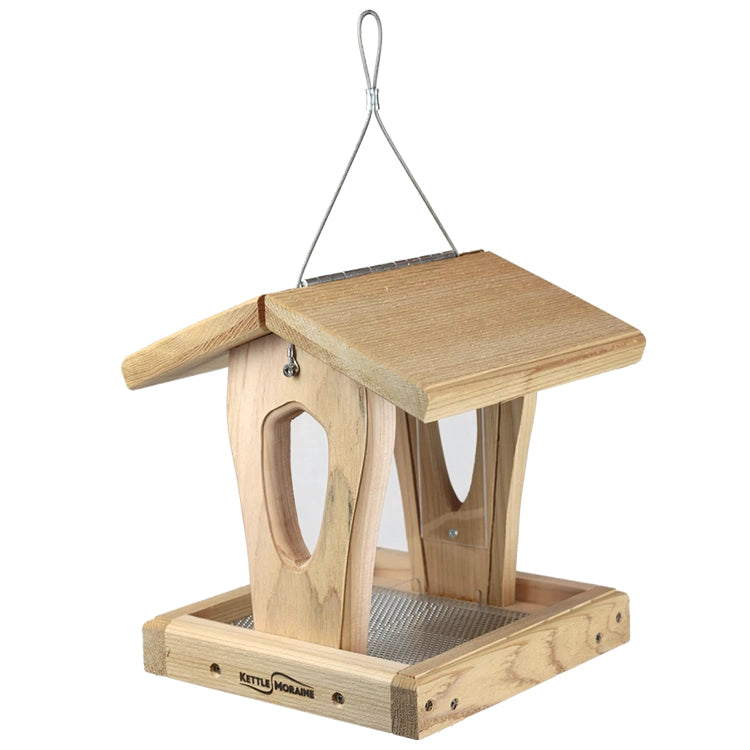 Compact cedar hopper bird feeder featuring screened tray, clear seed panels, and hanging cable.