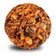 Sizzling Hi-Energy Woodpecker Seed Balls, featuring a mix of visible sunflower and pumpkin seeds, peanuts, dried fruit, and spicy capsaicin for squirrel resistance.